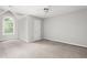 Bedroom with neutral carpet, a ceiling fan, an arched window, and a serene, airy feel at 4639 Reid Rd, Elon, NC 27244