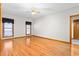 Primary bedroom with hardwood floors, natural light, and a ceiling fan at 4639 Reid Rd, Elon, NC 27244