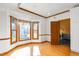 Bright breakfast nook with hardwood floors, bay window, and natural light at 4639 Reid Rd, Elon, NC 27244