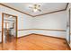 Spacious dining room with hardwood floors and wooden trim, perfect for entertaining at 4639 Reid Rd, Elon, NC 27244