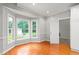 Versatile flex room boasts hardwood floors, large windows, and backyard views, perfect for an office at 4639 Reid Rd, Elon, NC 27244