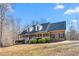 Lovely brick home features a covered front porch, perfect for enjoying the outdoors at 4639 Reid Rd, Elon, NC 27244