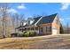 Beautiful brick home offering a wide, inviting front porch and attached garage at 4639 Reid Rd, Elon, NC 27244