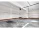 Attached garage with concrete floor, white walls, and an automatic garage door opener at 4639 Reid Rd, Elon, NC 27244
