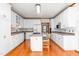 Bright kitchen with white cabinets, stainless steel appliances, and a center island with seating at 4639 Reid Rd, Elon, NC 27244