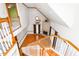Bright living room showcasing hardwood floors, fireplace, and staircase from above at 4639 Reid Rd, Elon, NC 27244