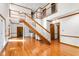 Open living area features a grand staircase, hardwood flooring, and lots of natural light at 4639 Reid Rd, Elon, NC 27244