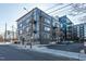 Modern building features dark siding, patios, and a well maintained parking lot at 521 N Mangum St # 33, Durham, NC 27701