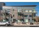 Modern building with a mix of metal and wood exterior, balconies, and a well-maintained surrounding landscape at 521 N Mangum St # 33, Durham, NC 27701