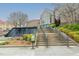 Durham Convention Center featuring a tranquil water feature, stairs, and landscaped grounds at 521 N Mangum St # 33, Durham, NC 27701