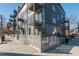 Exterior corner view showcasing modern architecture, balconies, and a sleek fence design at 521 N Mangum St # 33, Durham, NC 27701