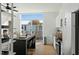 Modern kitchen featuring a breakfast bar, stainless appliances, and large windows with natural light at 521 N Mangum St # 33, Durham, NC 27701
