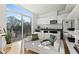 Bright living room with large window, modern furniture, and sleek kitchen in the background at 521 N Mangum St # 33, Durham, NC 27701
