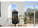 Bright office space featuring a modern desk, comfortable chair, and a view of the outdoors at 521 N Mangum St # 33, Durham, NC 27701