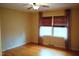 Bedroom with hardwood floors, a ceiling fan and windows allowing for natural lighting at 610 Westbrook Dr, Burlington, NC 27215