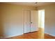 Spacious bedroom featuring hardwood floors and a large closet with louvered doors at 610 Westbrook Dr, Burlington, NC 27215
