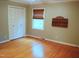 Comfortable bedroom with hardwood floors and natural light offering a serene space at 610 Westbrook Dr, Burlington, NC 27215