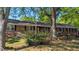 Charming brick home with a well-manicured front yard and mature trees offering ample shade at 610 Westbrook Dr, Burlington, NC 27215