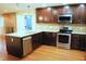 Kitchen with stainless steel appliances, granite countertops, and hardwood floors at 610 Westbrook Dr, Burlington, NC 27215