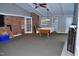 Recreational room with a pool table, brick accent wall, and ceiling fan at 610 Westbrook Dr, Burlington, NC 27215