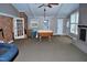 Large recreation room with a pool table, brick fireplace, and a wet bar, perfect for entertaining at 610 Westbrook Dr, Burlington, NC 27215