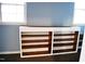 Built in shelving with white trim details between two windows at 610 Westbrook Dr, Burlington, NC 27215