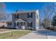 Charming two-story home with black shutters, a detached garage, and a concrete driveway at 620 Atwater St, Burlington, NC 27215