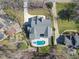 Stunning aerial view of a home with a private pool and jacuzzi in a lush, well-maintained backyard at 7621 Wingfoot Dr, Raleigh, NC 27615
