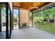 Inviting screened porch with a fireplace and views of the lush backyard at 7621 Wingfoot Dr, Raleigh, NC 27615