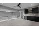 Finished basement featuring a wet bar with a wine cooler and custom cabinetry at 7621 Wingfoot Dr, Raleigh, NC 27615