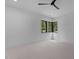 Bright bedroom with corner windows offering natural light and a view of the trees at 7621 Wingfoot Dr, Raleigh, NC 27615