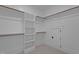 Large closet with custom-built shelving and rods, perfect for wardrobe organization at 7621 Wingfoot Dr, Raleigh, NC 27615