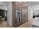 Modern kitchen with built-in appliances, custom cabinetry, and access to the dining and living spaces at 7621 Wingfoot Dr, Raleigh, NC 27615
