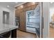 State-of-the-art refrigerator integrated within custom kitchen cabinetry for a seamless design and modern convenience at 7621 Wingfoot Dr, Raleigh, NC 27615