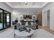 Open concept living room with modern decor, seamlessly connecting the kitchen and dining areas at 7621 Wingfoot Dr, Raleigh, NC 27615