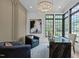 Well-lit office space featuring modern finishes, a unique desk, and large windows at 7621 Wingfoot Dr, Raleigh, NC 27615