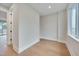 This bedroom features recessed lighting, wood flooring, baseboard trim and an open door to an adjacent room at 777 Willard St, Durham, NC 27701