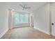 Bright, neutral bedroom with hardwood floors, large window and ceiling fan at 777 Willard St, Durham, NC 27701