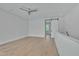 This bedroom features an open floorplan, recessed lighting, a modern ceiling fan, and access to an adjacent room at 777 Willard St, Durham, NC 27701