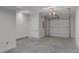 Well-lit garage with concrete floor and white door at 777 Willard St, Durham, NC 27701
