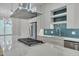 Modern kitchen with stainless steel appliances and a sleek quartz countertop at 777 Willard St, Durham, NC 27701