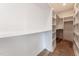 Spacious walk-in closet with built-in shelving and hardwood floors at 777 Willard St, Durham, NC 27701