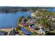 Aerial view of lakeside homes along a picturesque lake with a view of the neighborhood at 79 Cove Lndg, Sanford, NC 27332