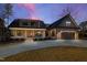 Charming home with stone accents, a two-car garage, and a welcoming front porch at 79 Cove Lndg, Sanford, NC 27332
