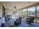 Relaxing screened porch features comfortable seating and views of the lake at 79 Cove Lndg, Sanford, NC 27332