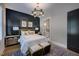Elegant main bedroom with a dark accent wall, stylish furnishings, and ensuite bathroom at 83 Stickleback Dr, Willow Springs, NC 27592