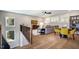 Cozy living room with hardwood floors, a gray sectional, and a walkout at 83 Stickleback Dr, Willow Springs, NC 27592