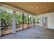 Large covered porch overlooking the backyard and trees at 83 Stickleback Dr, Willow Springs, NC 27592