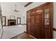 Welcoming foyer with hardwood floors, wooden front door, and a view into the spacious living room at 8320 Wycombe Ln, Raleigh, NC 27615