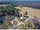 Aerial view of the home nestled amongst tall trees on a spacious lot at 10 Georgetown Woods Dr, Youngsville, NC 27596